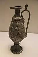 A ewer with Greco-Roman scenes from the tomb of Northern Zhou general Li Xian, 569 AD. It was probably made in Bactria.