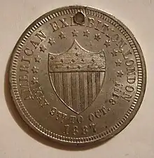 An aluminium token coin from the 1887 American Exhibition in London. At the time, aluminium was complex to produce and more valuable than silver