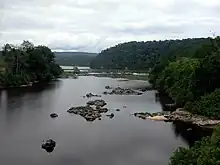 Rainforest-clad banks of the Ogooué, Gabon's principal river, the name being rendered Ogo-way in Griffon du Bellay's  "Exploration..."