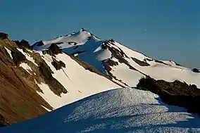 Partially snow-covered Old Snowy Mountain.