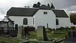 History: Just beyond the picturesque Tulbagh Kloof the road veers left and crosses the line at the railway station. Here one enters the Tulbagh basin, formerly called the Land of Waveren. It is an area rich with history—a history best exemplified by the old church, now a museum.
Because the old passes were so difficult to negotiate, the pion cattle farmers in this area lived in great isolation, cut off especially from church and cultural activities; those that trekked down the Breede River were even more out of contact with the church or the government. Commissioner Gustav van Imhoff believed that the church was one of the most powerful cohesive forces in a community and recommended that more churches should be built in the interior of the country. In this way the Roodezand congregation came to be established in 1743. In the same year the Rev. Arnoldus Mauritius Meiring, the progenitor of the Meiring family in South Africa, . arrived at the Cape from the Netherlands. After an eventful voyage during which he lost his wife, he was appointed minister to the Roodezand congregation.
Mr. Meiring’s first task was to give effect to Van Imhoff’s recommendation that a church should be built there. A simple little cruciform church was designed.
Much of thç material, including the typical small so- called "Batavian" bricks, was imported from Holland, and the floor was paved with slate. The building was done, for the most part, by two members of the con gregation, Jacs. Theron and Francois du Toit; the brickwork and the solid woodwork hear witness to their skill.
In 1796 the church was enlarged by extending the front by 3 metres and building a gallery. At the same time the fine baroque gable was built, as well as an attractive boundary wall round the church and graveyard.
Mr. Meiring served the congregation until his death on 23 April 1757. The church and its original pulpit remained in use until 1878. After Mr. Meiring’s death he was succeeded by the Rev. R. Harders (1758-1774); the Rev. J. A. Kuys (1777-1787 and 1789-1794); the Rev. M. C. Vos (1794-1802); the Rev. H. W. Ballot (1803-1814); the Rev. J. J. Kicherer (1814-1825); Dr. George Thom (1825-1833); the Rev. Robert Shand (1834-1871) and the Rev. W. Rdbertson (1871-1883).
When a new and bigger church was built in 1878, the "old" church served as school and as a hall for holding bazaars and other activities and in 1925 it became an historical museum."
Visual Description: It had a plan in the shape of a Greek cross, as was traditional for the earliest Cape churches (except Drakenstein and the first one in Stellenbosch). This was an appropriate adaptation of the wing-construction of the Cape farmsteads to the centralized Protestant 'pulpit churches' of the Netherlands. In 1795 the church was enlarged (out of money raised by selling Church St.erven and by borrowing from the Moederkerk in the Cape) by the addition of about 3 m to the length of the E arm, which now became the front, the original entrance having been at the S, turned away from the street and towards the former course of the wagon road. The W wing was extended by a similar distance; this became the vestry. Galleries were built in the 3 other arms. At the same time the gable over the new entrance was built, an ornate holbol one of the type that, nearer Cape Town, would have belonged to the 1780s; it is unusual in being used as an end-gable here. The ends of the other 3 arms are half-hipped.
The plaster pediment over the wide, vertically divided door, as well as the pilasters and swags flanking it and the heavy architrave, probably also date from this time, though stylistically they clash with the ornate baroque gable, as do the urn and swag on its face. But this, of course, can be expected in this transition period and far from the Cape. The windows have half-round heads. The interior of the church is of great simplicity and dignity of atmosphere. There is no ceiling, and the roof timbers are left exposed. The flagged slate
floor is fairly recent and replaced a clay floor, such as nearly all Tulbagh houses originally had.

Of great beauty is the pulpit, of stinkwood and beefwood, with its octagonal canopy and barley-sugar-turned posts. It may date from the earliest years of the existence of the church and, if so, is the oldest extant pulpit in the country. It was well restored by Lady Beck. In the churchyard, surrounded by a white wall – erected in 1795 – stands an early burial vault.
The church fell into disuse as such in 1878, when a new one, by Hager, was taken into use (since demolished). After having been used as a school for a couple of years, it stood empty and fell into disrepair – not improved by the reputed use made of it during the Boer War, namely to house English troops.

The old church was restored in 1914 and again in 1923 after it had, on the initiative of Lady Meiring Beck, been decided to turn it into a museum. After minor earthquake damage in 1969 it was once again restored, whereby some previous mistakes – eg the gate pillars – could be undone, and the date 1743 on the gable changed back to 1795. Type of site: Church, Museum Previous use: Church. Current use: Museum. This building is the oldest church building in the Cape still standing more or less in its original form.