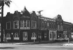 Photograph of the Ontario State Bank Block, a two-story, brick commercial building with an ornate roofline