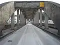 Interior of bridge with bottom of Oregon City Municipal Elevator visible