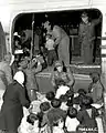 Orphans being loaded onto a C-54