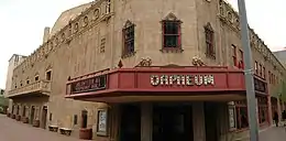 photo of the front entrance of the Orpheum theater, with the red marquee clearly displaying the Orpheum name, contrasted with the pale brown of the stone building