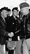 Oscar W. Koch receives congratulations from I Armored Corps commander George Patton in May 1942.