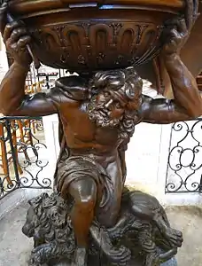 The base of the pulpit, supported by Samson kneeling on a lion