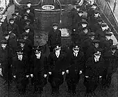 Officers and enlisted men of PC-1264 at its decommissioning.