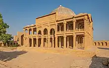 A large two-storey tomb made of sandstone