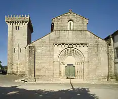 Travanca Monastery facade with a narrow slit window and its unique defensive tower.