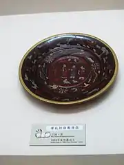 Painted lacquerware dish from the tomb of Zhu Ran (182–249 AD) in Anhui province, showing figures wearing Hanfu, Eastern Wu, Three Kingdoms period.