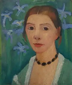 Self-portraitwith green background and blue irises (c1905)