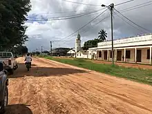 A street view of Pebane's main village centre with a small church