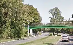 Peninsula Boulevard as it runs beneath a pedestrian bridge at Hempstead Lake State Park.