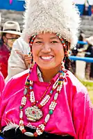 A Tibetan young girl wearing a fur hat