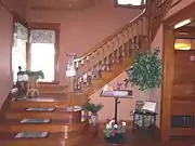 The interior staircase leading to the second floor of the house.