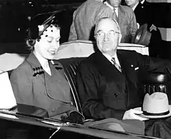 President Harry S. Truman and Princess Elizabeth, Duchess of Edinburgh in the presidential limousine en route to Blair House in Washington, 1951