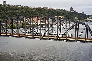 Light rail crossing the bridge