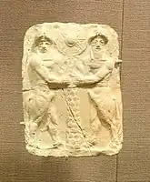 Plaque with bull-men holding a palm trunk with sun disk, Ishchali, Isin-Larsa to Old Babylonian, 2000-1600 BC, baked clay - Oriental Institute Museum, University of Chicago