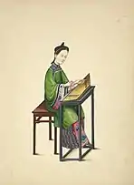 A woman wearing an ao with a long skirt, Playing a zheng, from 1800.