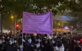 Police officers raised the purple flag after someone shouting slogans and singing was suspected of violating national security law