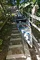 Canoe portage on the Tidan River using timber skids, nearby to road bridge F1838