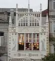 The detail of the Lello bookstore pinnacles and stained-glass windows