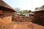 This dwelling, consisting of three stone rondavels, was built by Gustav Preller in 1920 and was initially used as a week-end residence. Dr Preller also placed the rondavels at the disposal of Afrikaans writers and artists. Type of site: Cemetery, House. Gustav Preller, the well-known protagonist of Afrikaans, historian and journalist built and occupied this house from 1935 until his death. Many of his later historical works were completed in this house.

This dwelling, consisting of three stone rondavel