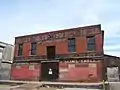 Warehouse that no longer exists which stood just west of the Jack Kerouac Lofts.