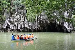 A river flowing into a cave.