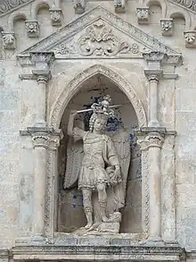 Statue of Saint Michael overlooking the entrance of the sanctuary.