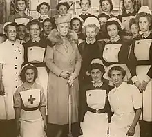 Queen Mary and Matron Saxby with the nursing staff (1948).