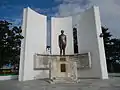 Outdoor monument of a standing Quezon