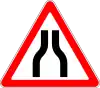 Road narrows on both sides