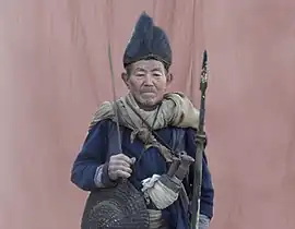 A Rai-Kirati priest wearing a kukri on his waist