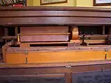 The interior of an 1895 Mason & Hamlin reed organ showing stop mechanism, swell case and Vox humana tremulant.