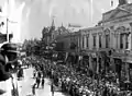 Returning soldiers march past Theatre Royal