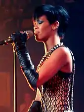 Colour photograph of Rihanna performing live in 2008.