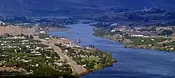 View of Rock Island, looking east up the Columbia River towards the Great Northern Railway bridge