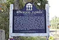 A color photograph of the back of the bronze plaque in Rosewood