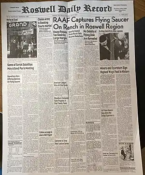 Newspaper headline reads, "RAAF Captures Flying Saucer on Ranch in Roswell Region". Full text is available on linked page.