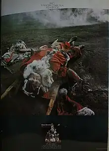 A photo of Santa Claus lying on a battlefield