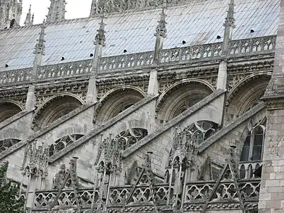 The buttresses and decoration of the roofline of the nave