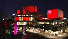 An artistic lighting scheme illuminating the exterior of the building