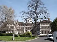 Former Royal Naval Academy (Buildings Nos 1/14, 1/116-19) and attached Railings