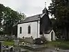 Kapel Notre-Dame du Mont Carmel, de zeshoekige muur van de oude begraafplaats en alle graven