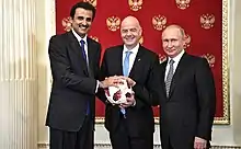 Image 25Russia handing over the symbolic relay baton for the hosting rights of the 2022 FIFA World Cup to Qatar in June 2018. (from Political corruption)