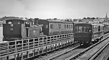 Steam train and electric tramcar in 1965