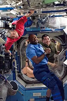 Leland with his crewmates in the Destiny lab during STS-122