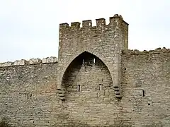 A small tower riding on the wall west of the South Gate